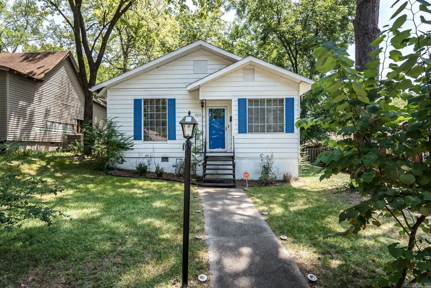 Fantastic one-level home in a prime location within walking distance to UAMS.  This updated, move-in-ready home is perfect for first-time home buyers or investors. Enter from the charming front porch into the open concept living and dining area. The entire home is painted neutral colors and offers new light fixtures throughout. The eat-in-kitchen features custom concrete countertops, new stove and vent-a-hood, refrigerator and breakfast nook. The primary bedroom features an abundance of natural light with two closets. Enjoy the oversized updated bathroom featuring a large double vanity with granite countertops and a tub/shower combination. Off the kitchen you will find the laundry room offering ample storage space. Step outside to the private, fenced backyard with a spacious outdoor deck perfect for entertaining. Additional features include: whole home security system, stylish dining room accent wall, and new exterior paint.