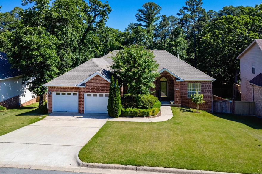 Beautiful one level home with a desirable split floor plan, open layout, and tall ceilings throughout. Fresh neutral paint and abundant natural light create a bright, welcoming feel from the moment you enter. Formal dining room opens to spacious living areas featuring a fireplace shared between the main living room and the family/hearth room just off the kitchen, making the spaces perfect for both entertaining and everyday living. Kitchen offers granite countertops, newly updated stainless appliances including an induction range, dishwasher, and microwave, along with new light fixtures in both the kitchen and dining room. Private primary suite features a vaulted ceiling and an updated spa inspired bath, separated from two guest bedrooms and a hall bath for added privacy. Step outside to covered and uncovered multi level decks overlooking the inground pool and beautifully landscaped, wooded, fully fenced backyard. Under house storage is a plus. Charming, comfortable, and easy to live in, this move in ready home offers wonderful indoor and outdoor living spaces in a lovely setting. Come see!