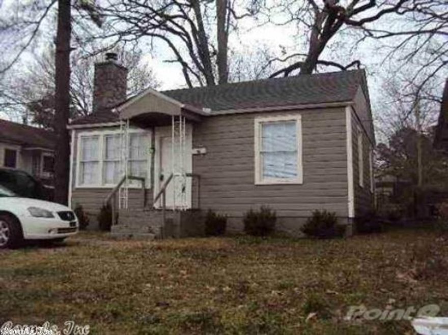 GREAT INVESTMENT PROPERTY......Across the street from UALR.  Cute 2 bedroom 1 bath home with many updates.  Electrical, Bathroom, Tile, Plumbing, Fixtures Newer appliances.  Stove, Fridge, Washer & Dryer to convey.  Attractive rock gas log fireplace in living room.  Cathedral ceiling in living room with wood tongue and groove finish.  Separate eating area.  Detached 1 car garage.  Nice size backyard with alley access.  Sq footage is estimate - Please measure for accuracy.  Great Cozy House!!!