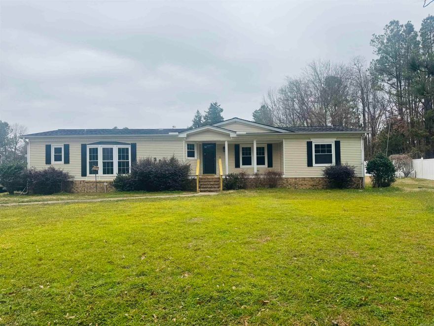 Escape to the peace and privacy of country living with this 3 bedroom, 2 bath double wide situated on 13.23 beautiful acres. If you’ve been dreaming of space to spread out, this property delivers.  The home offers a spacious layout with comfortable living areas and a functional floor plan perfect for everyday living. Step outside and you’ll find room to roam, whether you’re looking for recreational land, a mini farm setup, or simply wide-open space to enjoy.  A large shop provides excellent storage, workspace, or room for hobbies and equipment. The pole barn and covered parking areas add even more versatility, making this property ideal for vehicles, tractors, boats, or outdoor gear.  Whether you’re wanting privacy, land, or space to build your vision, this one checks all the boxes. Country setting with room to grow — opportunities like this don’t come around often.