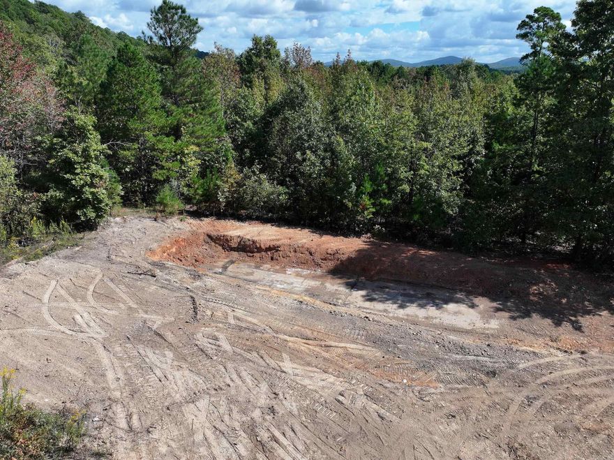 Discover the potential of this 5+/- acre property nestled at the base of Mt. Riante. Offering a blend of open and wooded areas, this versatile land provides plenty of possibilities. A mobile home is included with the sale and being SOLD AS-IS. Conveniently located just outside city limits, only minutes from local amenities. Seller open to possible owner financing with acceptable terms.