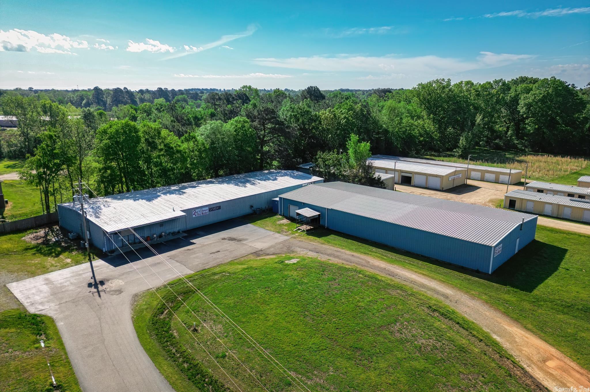 Great Opportunity! THE PROPERTY HAS 3.07 ACRES +/- WITH 18,000 SQ. ft . +/ - METAL BUILDING -COMMERICAL PROPERTY INSIDE THE CITY LIMITS ON HWY 29 SOUTH ACROSS THE HIGHWAY FROM UNIVERSITY OF AR. AT HOPE, AR. THE METAL BUILDING IS BUILT ON CONCRETE SLAB, HAS A STEEL FRAME WITH FIBERGLASS BACKED INSULATION AND METAL SIDING . THE BUILDING HAS A/C AND GAS HEAT, RESTROOMS, AND AN OFFICE/ RECEPTION ROOM. THERE IS A LOADING DOCK WITH AN 8 X10 COVERED TOMMY LIFT. THE BUILDING IS PRESENTLY BE USED AS A FLEA MARKET. ALL FLEA MARKET ITEMS WILL BE INCLUDED IN THE SALE OR REMOVED. THE PROPERTY IS LOCATED IN A NON-FLOOD ZONE. THERE ARE TWO ADVERTISING SIGNS ON THE PROPERTY WHICH ARE CURRENTLY BEING LEASED FOR $1,000 PER YEAR (TOGETHER). (394 FEET HWY FRONTAGE)