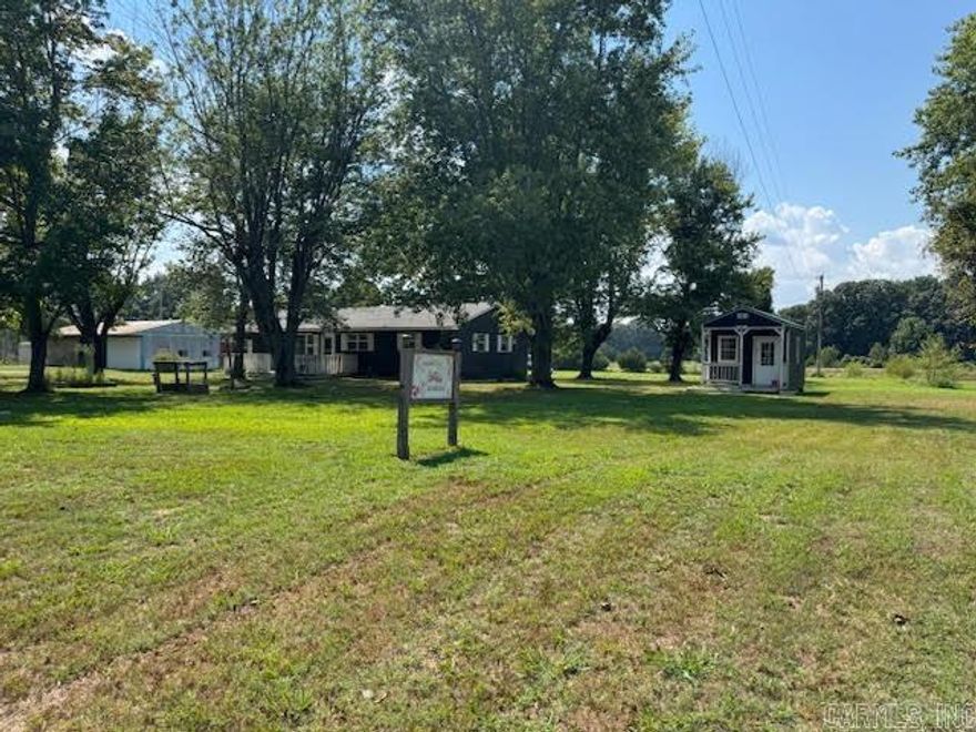 This home and location has tons of potential! The 1404 square foot home has 3 bedrooms and 1.5 bathrooms, sunroom, 2 year old windows, huge living room, kitchen with rolling island, stove, refrigerator and dining area. Cute sliding barn doors! Home is heated and cooled with a 3-year-old 2-ton Mini split and a 5 burner LP gas stove for backup heat. Front and back decks on the home. Rural water and septic system that was pumped 3 years ago. Large LP tank that goes with the property. 14X12 finished building with electric, ceiling fan and covered porch that is only 2 years old. Nice pond with catfish, bass and crappie that was stocked in 2020 and 2023. Even comes with your own homemade worm bed! Nice level 2.6 acres! Great location just out of Imboden. The home needs some work so it will not qualify for a VA, RD or FHA loan. You will need to do cash or in house conventional loan!