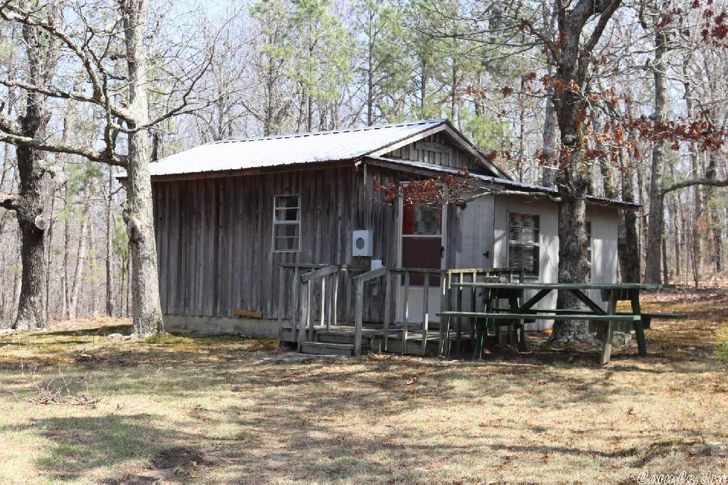 This property has a total of 320 acres with endless possibilities and all the privacy you could want. There is a county road that runs through the property creating great access. There is a hunting cabin already on the land with water and phone run to it. Currently it is powered by a generator but power could be brought in if someone desired. There is power at the end of the property but would have to be brought to where someone wanted to build. Small creek with waterfall. Spring fed pond. Views! $750,000