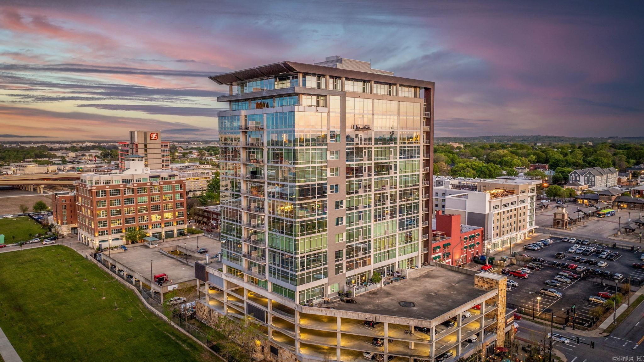 Spectacular sunsets every night in this fabulous downtown penthouse! This is a unique opportunity to own a one-of-a-kind, exceptional luxury property. The indoor-outdoor spaces blend perfectly, making it an entertainer’s dream! Immaculate and completely remodeled interior w/designer touches, this 3 bedroom, 3 & ½ bath is truly exceptional. Two separate entry foyers open to elegant living/dining spaces with custom tray ceilings, flooded with natural light & floor-to-ceiling windows that showcase the Arkansas River and City of Little Rock. Gorgeous formal dining room with stunning double chandeliers. Walk outside to a massive flagstone wrap-around balcony with north and west facing views. Spectacular custom chef’s kitchen is anchored w/stone countertops and Viking appliances. Lovely breakfast bar adds loads of charm. Richly appointed spaces include sophisticated art. Every bedroom has an en-suite, spa-inspired bath, all with incredible views. Two parking spaces on 2nd level next to the entrance. The property is being sold fully furnished. There is concierge, security, a pool, dog walk, exercise room, & excellent restaurant. The shared lobby was just remodeled. Agents, see remarks.