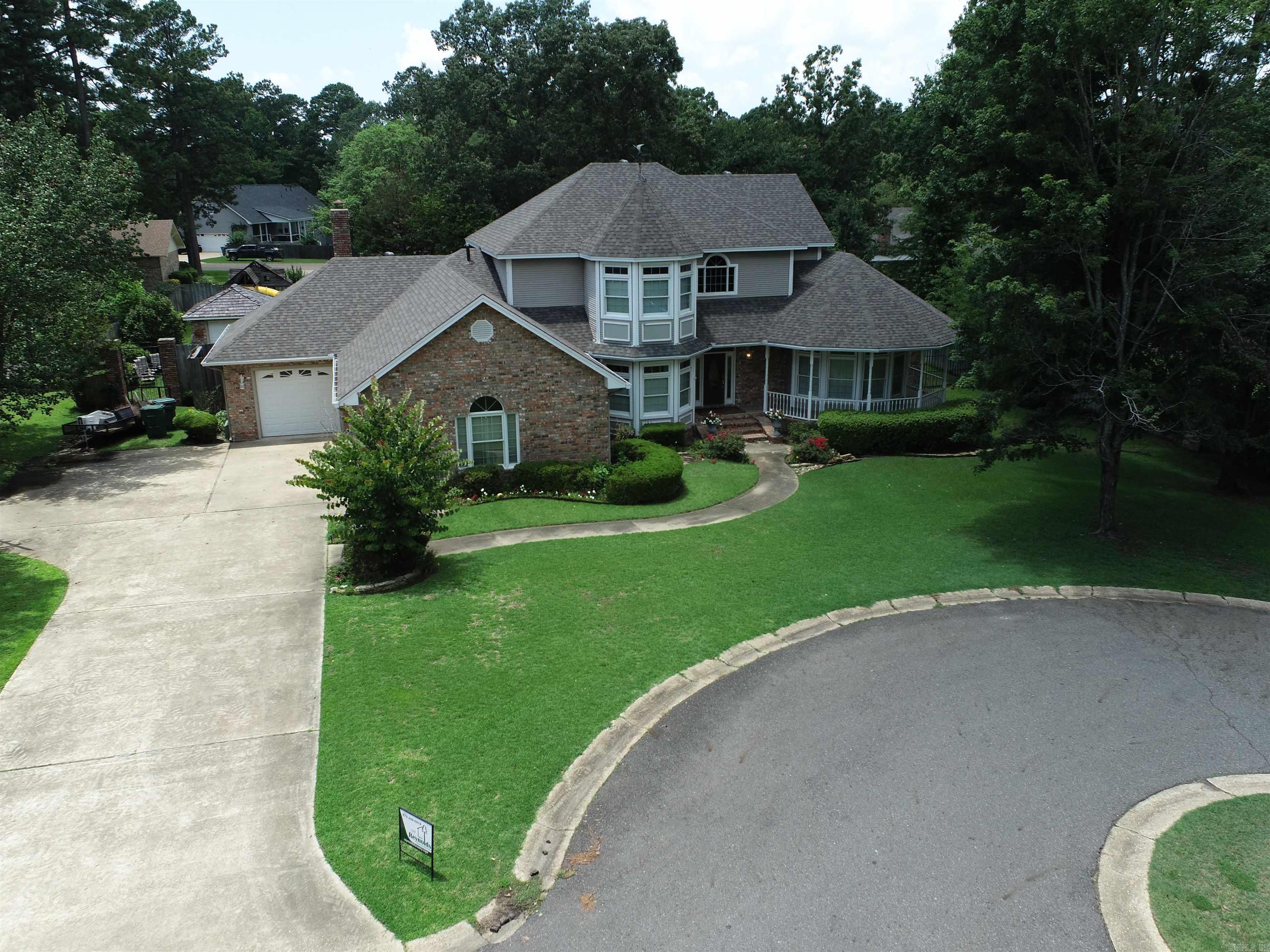 OASIS ON TANGLEWOOD. This immaculate home offers a designer floor plan and custom decor that delivers 3 BR 2.5 BA, and a game room that could be used as a fourth bedroom. An elegant dining room, striking living room with surround sound, fireplace, built in bookcases and wood floors. The master suite has tiered ceiling and lighting and stain glass transom. Master bath offers granite counter tops and uniquely tiled shower. Also, a huge wrap around closet and whirlpool tub is designed for relaxing. The kitchen is very user friendly with island, granite counters, under counter lighting, double oven, ice machine, new dishwasher and custom cabinets. A breakfast area convenient to the kitchen. The outside deck, gazebo and saltwater pool is perfect for outdoor entertaining. A professionally landscaped yard is surrounded by 8' treated pine fence. This home has new 2023 roof and a brick storage building in back yard.