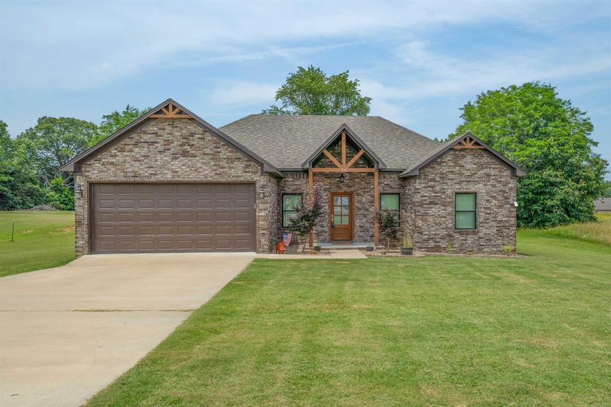 Built in 2021, this charming home on 1.38 acres offers a split floor plan, open-concept living. Kitchen has wood shaker style cabinets, granite countertops, SS appliances, open to living area with LVP flooring throughout - combining durability with style. The spacious primary suite features a large walk-in closet connected to the laundry room for added convenience. The primary bathroom shower features  garden soaker tub, updated tile work, a rainfall shower-head, and a standard shower-head for a spa-like experience. Located in a rural neighborhood with easy access to nearby amenities. Enjoy modern living with country charm - and it qualifies for 100% financing!