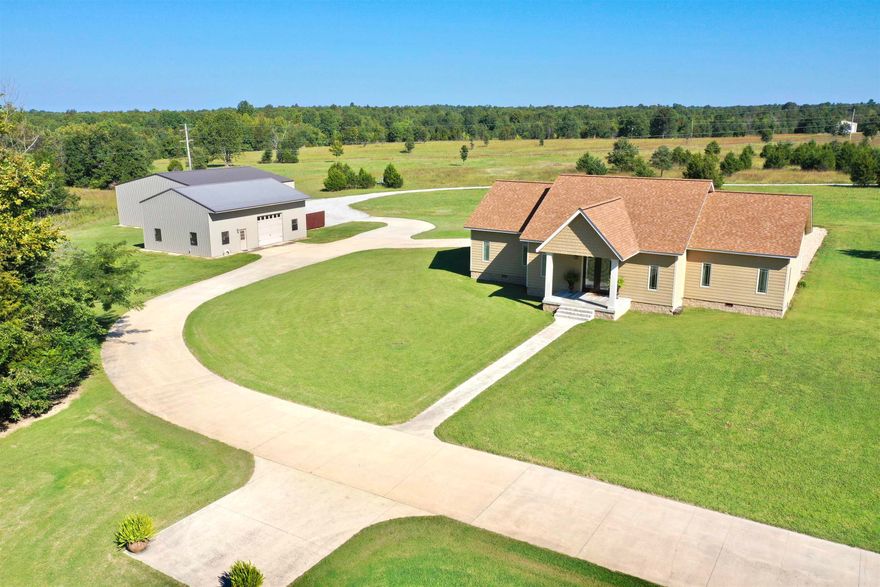 STUNNING, WELL MAINTAINED HOME located in Viola! This 3 bedroom, 2.5 bath home sits on a manicured 20 acre tract. From the moment you pull into the driveway, walk up the steps & into the front door, you immediately notice the unique custom characteristics of this home. This home features an open floor plan with a custom kitchen offering stainless appliances, granite countertops, large island, & walk in pantry/coffee bar. Formal dining area plus an additional sitting area with gas fireplace insert. The Master suite offers a large bedroom with sitting area, walk in closet, & full bathroom with soaking tub and walk in shower. Located off the kitchen is a large Sunroom with access out to the back patio where you can sit pool side at an inground salt water pool. There is a 30x50 shop with a studio apartment offering a kitchen, living area, & full bathroom. Additional 50x50 red iron storage building, 2 ponds, orchard, & a 1 vehicle attached garage.  Owner will finance with an agreeable down payment! Call me today to see this beautiful property!