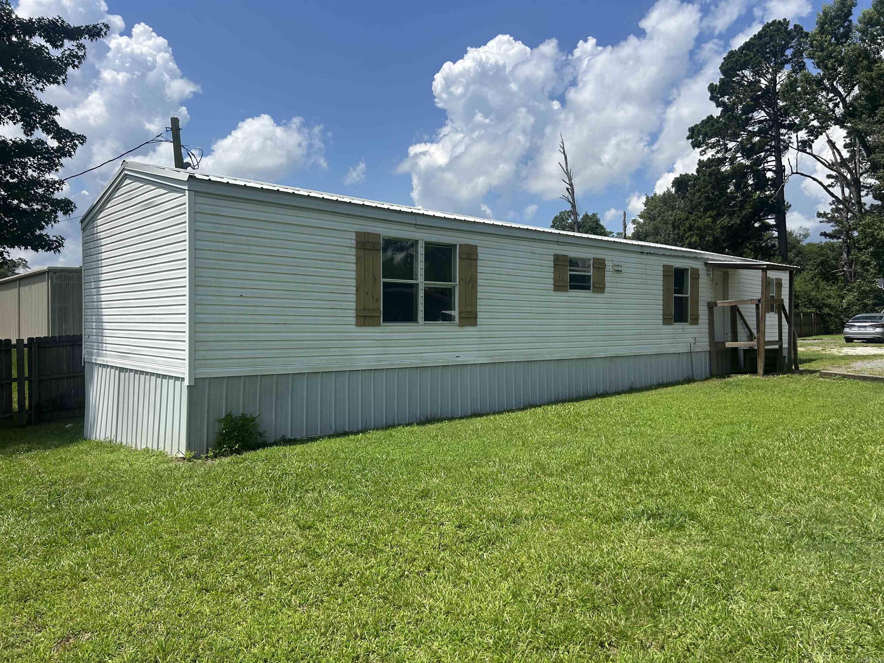Cute 2-bedroom 2 bath home in Sheridan 3-year-old metal roof 3-year-old metal under pinning Recently painted on the inside. 3-year-old outside ac unit