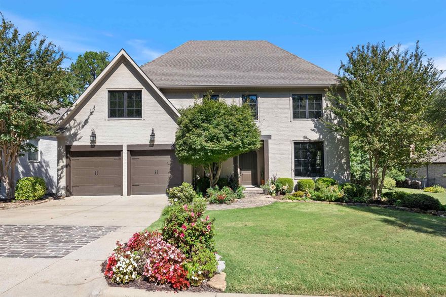 Stunning brick home with classic curb appeal and beautifully landscaped grounds. Inside, enjoy sophisticated design with an open floor plan featuring a formal dining room, chef’s kitchen with quartz countertops and premium KitchenAid appliances including gas range, oven, convection microwave, dishwasher & ice maker, breakfast nook with banquet seating, and spacious great room with gas log fireplace and built-ins. Additional features include a stylish half bath, laundry/mudroom with storage, and two-car garage. The main level includes a luxurious primary suite with hardwood floors, spa-like bath, and custom walk-in closet, plus a guest suite with private bath. Upstairs offers two large bedrooms, hall bath, and game room with wet bar and beverage fridge. Fabulous outdoor living with a covered patio, fireplace with gas logs, new composite decking, pergola, and mature trees frame the backyard. Basement hobby room with 830 square feet and encapsulated crawl space add efficiency and functionality. Gated community with HOA-maintained roads, lights, and weekly yard care.