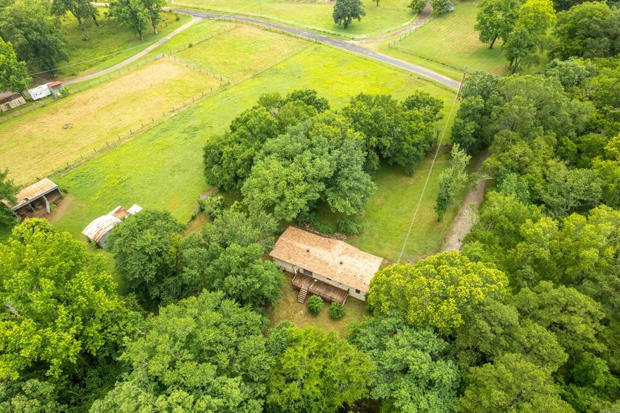 Looking for the perfect spot to start your mini-farm or just enjoy some elbow room? Cozy mobile home sits on 10.54 beautiful acres and has everything you need to live the country life. Equipped with 2 or 3 bedrooms | 2 full baths, fresh updated flooring and lighting throughout open living/dining area with lots of natural light. 10.54 acres – bring your horses, cows, goats, or chickens! Cross-fenced pastures ready for grazing or rotating livestock. Two pole barns, room for gardens, greenhouses, or even more animals! Perfect for equestrian enthusiasts, just a short drive from town in the coveted Lake Hamilton school district.