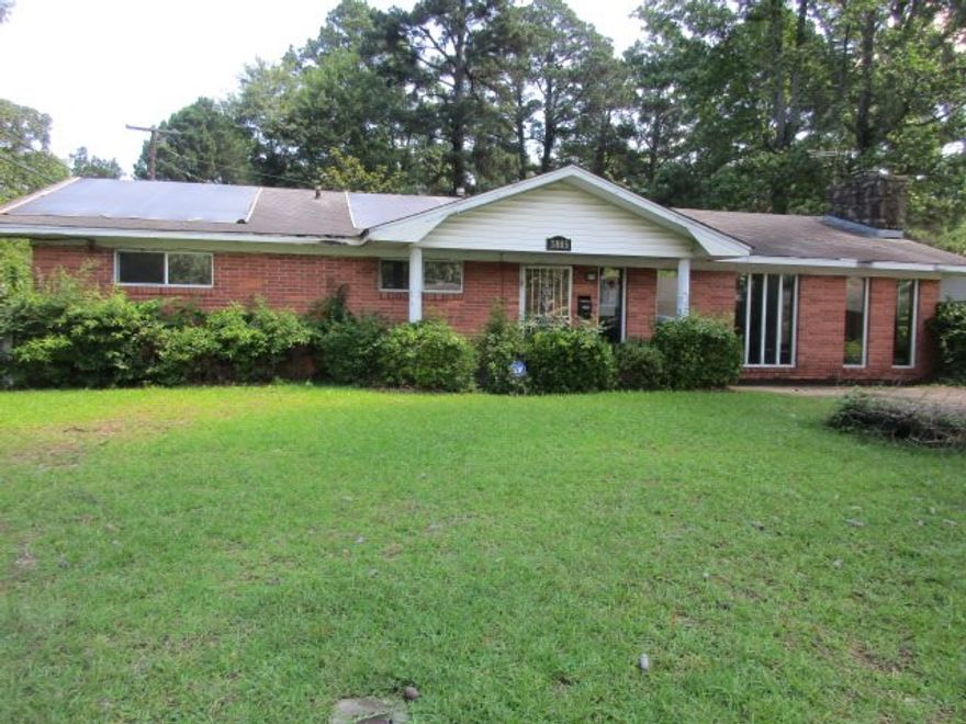 Brick home in Sherwood Forest Subdivision.  3 bedrooms and 1  1/2 baths, large den with stone fireplace, kitchen/dining combo.  Carport has a nice room off of it that is heated and cooled, could be workout room or office.  This home has a storm shelter and a small storage building.  Call today for your personal tour.  **Agents see remarks**