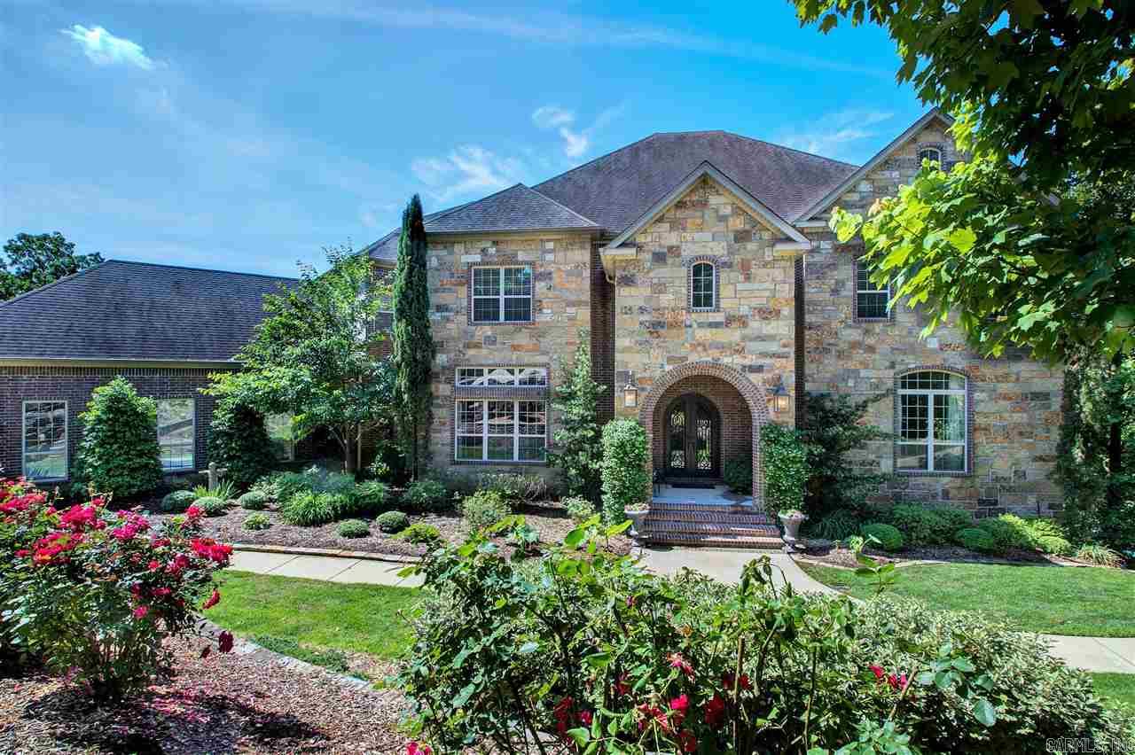 TRULY ELEGANT home situated on Lake 1 in Lakewood. Step into the 2 story foyer with gorgeous curved staircase. Fabulous barrel ceiling through main hall which opens to spacious Great Room & Kitchen, ALL overlook the lake. Spacious master, Kitchen w/granite, center island, pantry & butler pantry. 2 story library/office, Downstairs has huge separate living, game room area, bath, sauna, changing & workout rooms (could be BR), sound proof music room & media room. In Ground Pool, storage galore. STUNNING!
