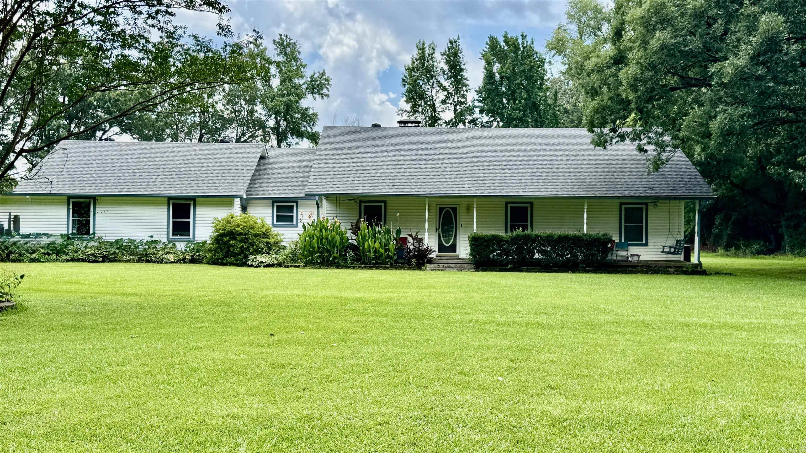 Just in time for summer! This property has it all. 3bd 2ba home on 1.27 acres with a 40x40 shop and a 16x32 unground pool. There is a bonus room that could be another living room, bedroom, or even a big play room. There have been so many improvements to this property. New vinyl flooring, Driveway was paved 2015, Storm shelter installed 2015, new pool liner 2020, New pool pump & equipment 2021. New roof 2020. New windows and gutters 2021, Solar panels that will be paid off at closing. New heating system, Hot water tank 2019, Master bathroom remodeled with new shower, Carport with 18x20 storage. Old log house on property, Fenced in yard.This home is a must see!