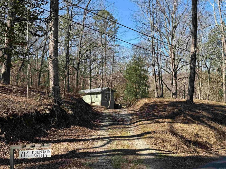 First home, last home, small home, weekend crash pad, vacation rental, investment opportunity - whatever you identify. It is low maintenance, cozy, well appointed, in a quiet area and what feels like a million miles away from most signs of close proximity to humans yet near to downtown Hot Springs, shopping, dining, thermal water bath houses and art galleries. Surrounded by nature adjacent to hiking / biking trails and national park boundaries. Turn key rental, furnished and an active short term rental license all convey. The property is 1.25 acres and had prior utility connection to a now removed additional dwelling. It may be possible to add another structure considering lot size and prior use. This is a guest favorite on Air Bnb. Check the calendar and try before you buy. Located in such a cool area and so many different uses this might not last long, so do not delay!