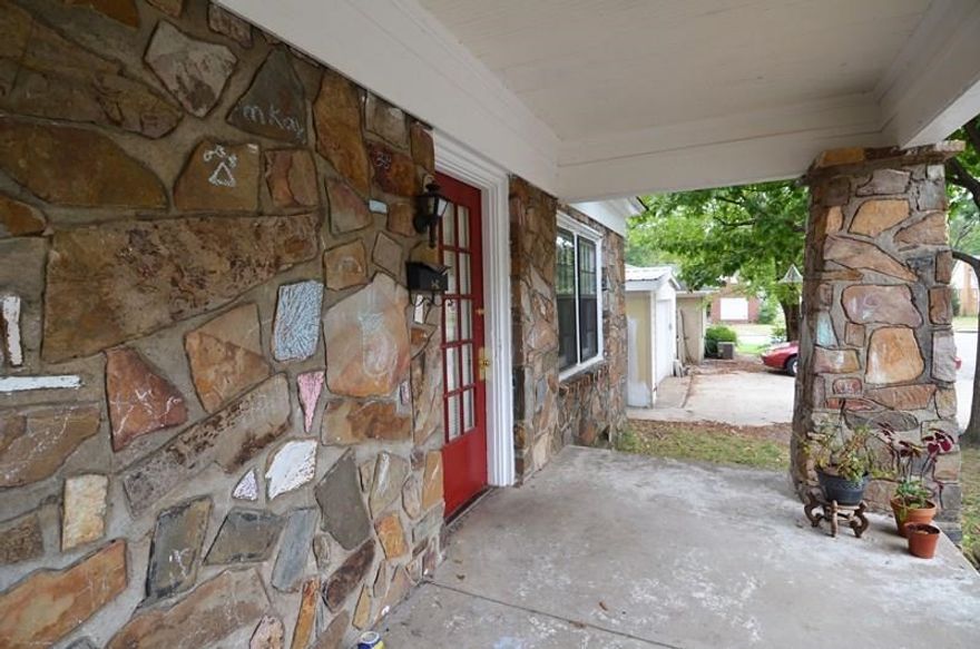 Built in 1929, this house is not lacking in character or history. Beautiful stone work on exterior, & around interior fireplace; built ins flank the FP, & built in china hutch in the DR; flat & fully fenced back yard; large front porch; bonus sunroom that can be used as a playroom/office; separate DR; hardwoods; off street parking. This is a great buy for an Investor, UAMS students, or Buyers hoping to take an old home and put their personal touches on it.  Home sold as-is.  24HR NOTICE. See Remarks.