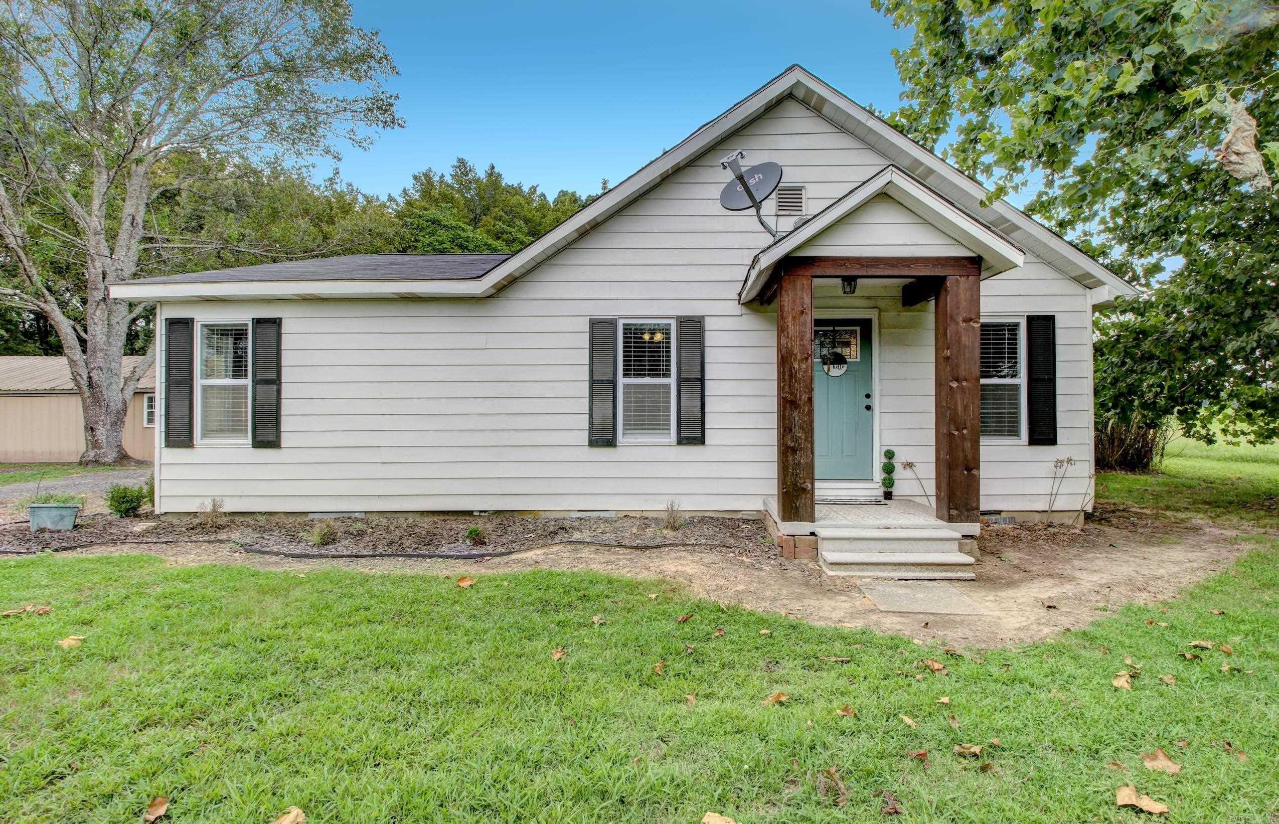 Lovely Home off Highway 13 North in Carlisle! Remodeled within the last 5 years, updates include HVAC, roof, windows, electrical panel, plumbing, LVP flooring, sheetrock, bathrooms, lighting and insulation. This home is an open concept with farmhouse touches throughout. Butcher block countertops are featured in the kitchen. Some rooms have the original tongue and groove ceilings and there is a shiplap wall in the living room. The sunroom is not included in the square footage of the home. An expansive deck with a covered pergola is perfect for summer and outdoor entertaining. The 36x25 shop is has electricity and work benches. Come see this one today!