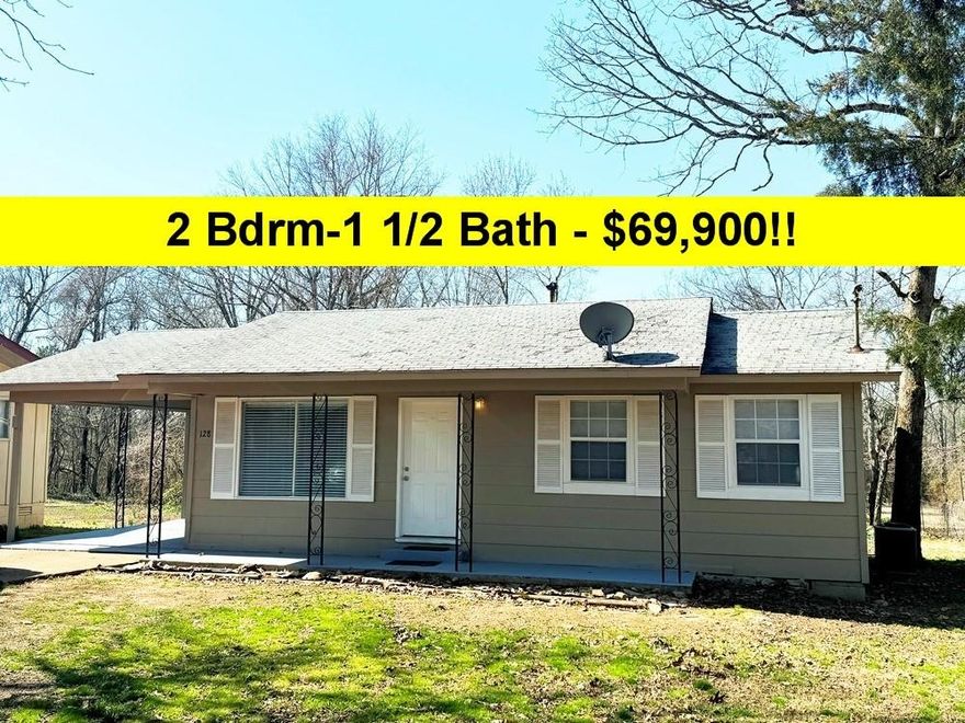 SUPER DEAL!  2 bedrooms, 1 1/2 baths, utility room.  Attached 12'x10' shop or storage.  Nice LEVEL LOT!  Carport NEWLY painted appears to be in great shape.  Heat Pump.  Includes stove & refrigerator.  Laminate & vinyl plank flooring and tiled entry.  New blinds on windows, septic tank has been replaced per owner, older roof, but doesn't leak per owner.  Ready to move into! $69,900 without new roof or $79,900 with new roof.  Call Quick! #2403