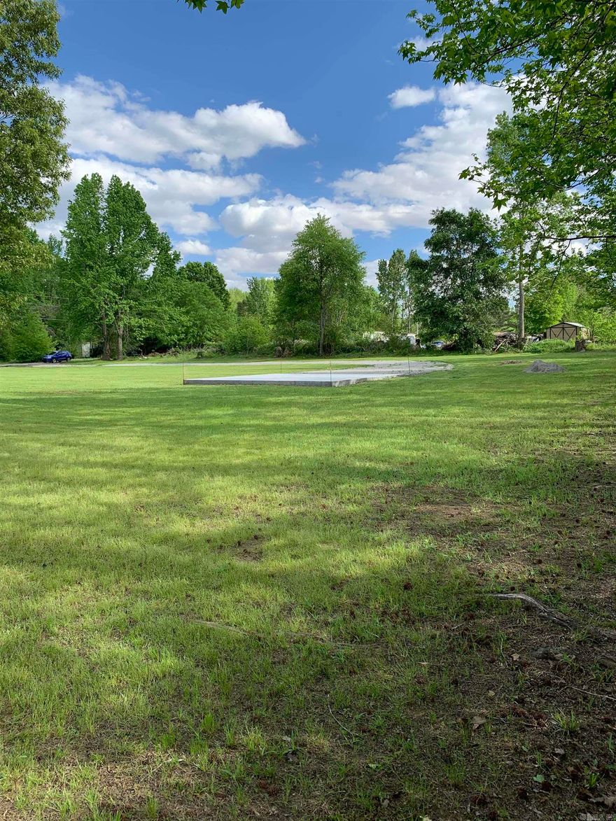 Beautiful piece of property just waiting on your new home.  This corner lot sits in the perfect quiet spot to raise your kids, goats, chickens or whatever your heart desires!  There are no restrictions preventing your imagination from running wild!  The property has an established address, a gravel drive with a two car gravel parking area.  There is a 26x25 concrete slab on the property that is ready for you to build a spacious shop.  Water is on the property, there is a current survey and the property has had a perc test with approval by the Arkansas Health Department.  Don't miss out on this one!