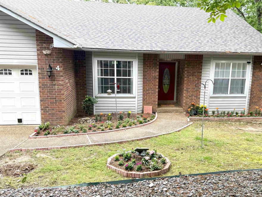 Gorgeous Home in Hot Springs Village! Welcome home to this open, bright, and beautifully updated property- truly a must-see! Fully remodeled in 2023 with quartz countertops, this home features an oversized primary bedroom, stylish LVP flooring, LED and recessed lighting, and a highly functional layout with abundant storage throughout. The main level offers two bedrooms, two bathrooms, a well- appointed kitchen, inviting living room, and a convenient laundry room. The spacious primary suite includes two large walk-in closets and direct access to the back deck, perfect for enjoying the outdoors.   The lower level boasts new carpet, a traditional bedroom, a full bathroom, and a second living area currently used as a bedroom and already plumbed for a kitchenette- ideal for guests, extended living, or future income potential. A bonus room off the downstairs storage area serves as a cozy animal suite, complete with a pet door leading to the lower backyard patio.  Don't miss this incredible opportunity, schedule your showing today! Agents, see remarks.