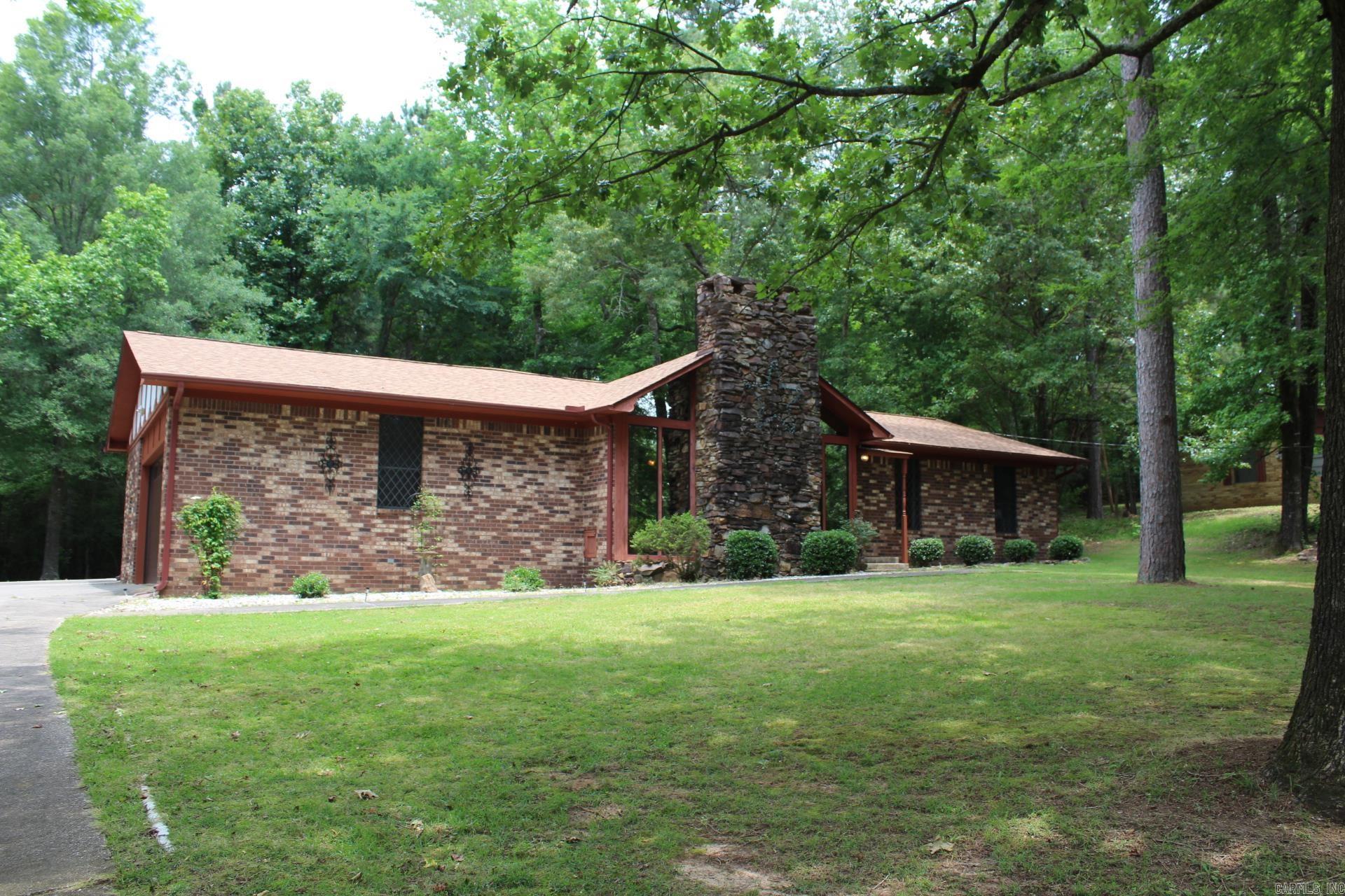 3 bedroom, 2 full baths with approx. 1903 Sq. Ft. of living space on approx. 1.02 acres (two lots). Kitchen has plenty of storage and builtin wall oven. Family area features a large fireplace (gas), beamed vaulted ceiling. Central AC & Heat. New roof. All appliances and furnishings conveys with sale of home. Property is just a short drive to Crater of Diamonds State Park or Lake Greeson.