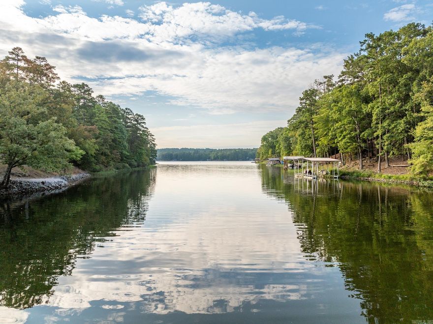This spacious, 1.3 acre lot, is nestled in a quiet cove on Lake Coronado. Featuring approximately 150-feet of shoreline and 280-feet of road frontage, there is abundant potential for building your dream home while still maintaining privacy.  Lake Coronado is a full-recreational lake and is the second largest body of water in Hot Springs Village, with about 380 acres and a maximum depth of about 70 feet. With ample opportunities to fish, swim and enjoy water sports, it’s sure to be a warm weather hot spot. Come and see this beautiful lot for yourself. **Possible owner financing available**