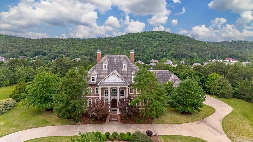 Tucked inside the gated Valley Falls Estates, this custom home sits on 4.4 private acres and brings luxury, space, and comfort all under one roof.  You’re welcomed in by a dramatic dual staircase that sets the tone for the rest of the home.  The layout gives you tons of flexibility — with various living spaces, a large kitchen made for big gatherings, bonus rooms, covered areas up and down and your own wine cellar on the lower level.  The primary suite is a retreat all on its own, complete with a sauna, private workout room, and a closet that’s fully decked out.  The elevator takes you to the third floor that features a 1,300 sqft apartment with a full kitchen perfect for a nanny or in-laws quarters.  Call to see it today!