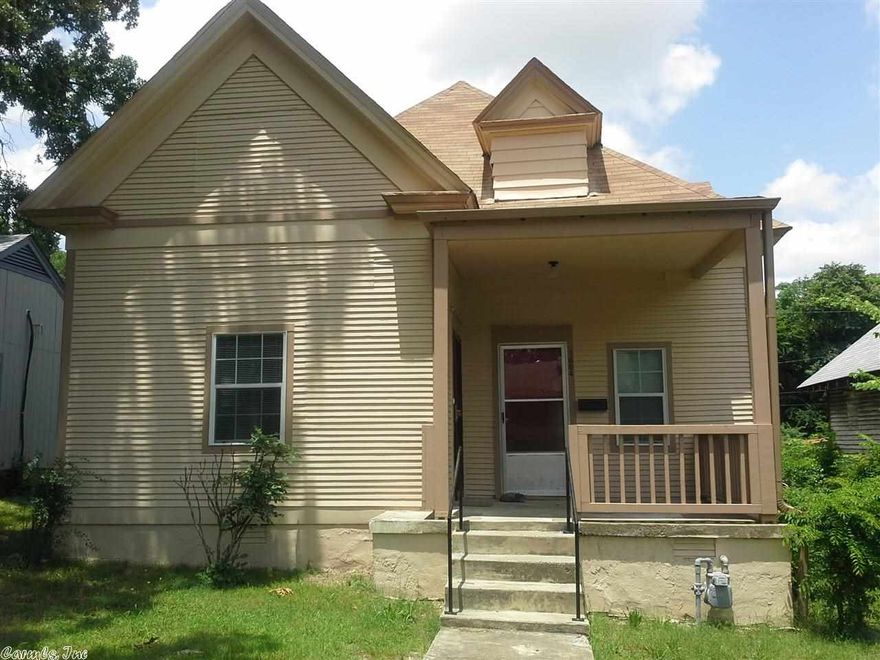 The eat in kitchen is furnished with a fridge, gas range, dishwasher and disposal.  Separate dining room area  There is a separate room with washer and electric dryer connections.  INCLUDES mini blinds, central heat/air, fenced in yard, porch, vinyl and hardwood floors, an eat in kitchen space and two bonus rooms added on a dining room and a den.  Convenient to I-30 & I-630 local restaurants, shopping centers and hospitals.  Animals may be allowed if requirements are met.