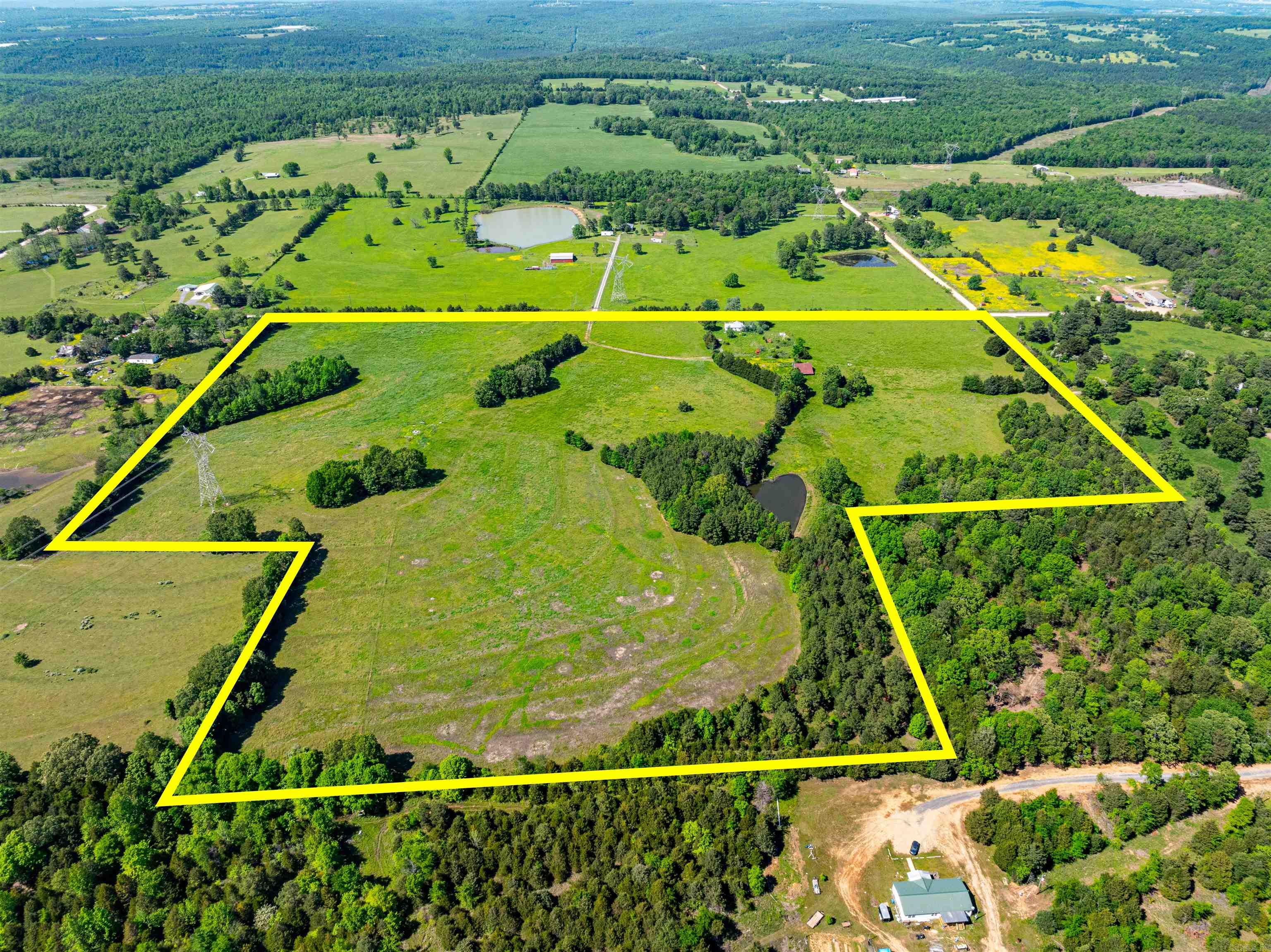 Incredible 41 +/- acre property, sitting just off Highway 167 on Jackson Road 6, Bradford, Arkansas, with Jackson Road 6 and 197 road frontage. This property consists of pasture, some woods, a nice pond, an old home that could be remodeled, county water at the house, electricity at the house, an old well that the current seller uses for the water tanks for the cattle, fencing set up to work for the cattle and just excellent pasture! This farm has been cleaned up and is a beautiful working cattle farm. If you have been looking for a farm to start with, a place to build that home and have room to have cattle, or want to have a slice of the Ozarks, this would be the one to start with! We would love to help you make this dream come true. Just a few miles from Baldknob or Batesville in a great location!