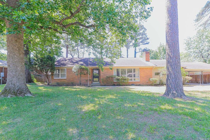 Welcome home to this charming single-level family residence nestled in a highly desirable location with beautiful landscaping and mature shade trees that create a warm and inviting setting. Thoughtfully maintained and updated, this home features a new water heater along with updated plumbing and bathroom fixtures, offering both comfort and peace of mind.  Inside, you'll find a spacious and functional layout designed for everyday living and entertaining. A standout feature of the home is the large family room addition complete with a cozy wood-burning fireplace - the perfect gathering space for holidays, relaxing evenings, or entertaining friends and family.  With its combination of charm, updates, and comfortable living spaces, this home offers the ideal blend of convenience and character for families of all sizes.