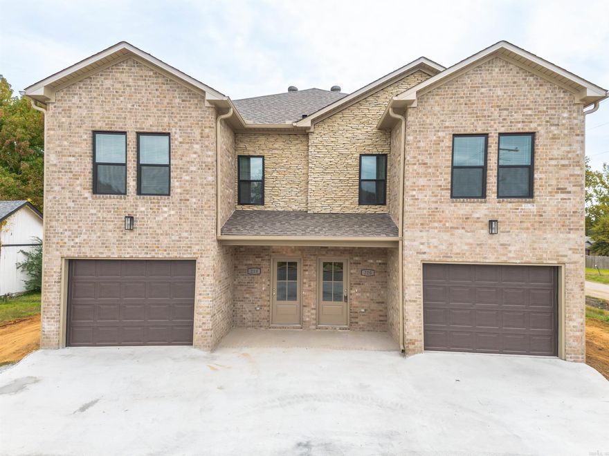 Investment Powerhouse! Luxury new construction near Little Rock Air Force Base. Own a high quality, all brick, duplex in Jacksonville just minutes from the base and an easy 15 minute drive to downtown Little Rock, built for long term performance and high end rental demand. Each townhome style unit features 3 bedrooms, 2.5 baths, and a one car garage that opens into a spacious downstairs living area with a convenient half bath. Upstairs offers a primary suite with private bath and walk in closet, plus two additional bedrooms connected by a Jack and Jill bathroom and a dedicated hall laundry room. Premium finishes include quartz countertops, custom hardwood cabinetry, built in microwave, dishwasher and range, luxury vinyl flooring, energy efficient windows and doors, and blown in insulation for lower utility costs. Prime retail corridor location with walkable access to two grocery stores, Lowes, Harbor Freight and local dining with no freeway crossing. Walmart and additional shopping are just across the bridge. Minutes from the Jacksonville Community Center, pool and city water park. Images shown are from a prior build of similar design and finishes. Projected completion/CO in 2026.