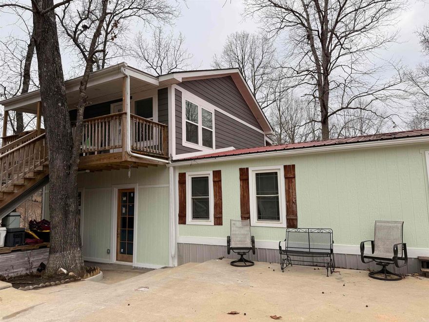 A MUST SEE!!! AN AMAZING MOVE IN READY HOME on over 1 acre and/or AN AWESOME Income Producing Investment Opportunity.  YOU CHOOSE!!! A Beautiful 7 bedroom 4 bath home on over 1 acre.  The front double doors open to a spacious living area and a lovely kitchen. This beautifully remodeled main home is 1,540 sq ft.  A new metal roof added in 2023.  The home also features a 2 story addition of 1,120 sq feet for a total of 2,660 sq ft.  The main home is a split floor plan with the primary suite to the left of the entry and 3 additional bedrooms to the right of the entry.  The 2 story addition lower level is a fully contained 2 bedrooms with a kitchen, storage room, laundry and full bath. The upper floor has a charming main suite with living room, kitchen and full bath.  For rental income, please contact agent. The duplicate listing 25011528