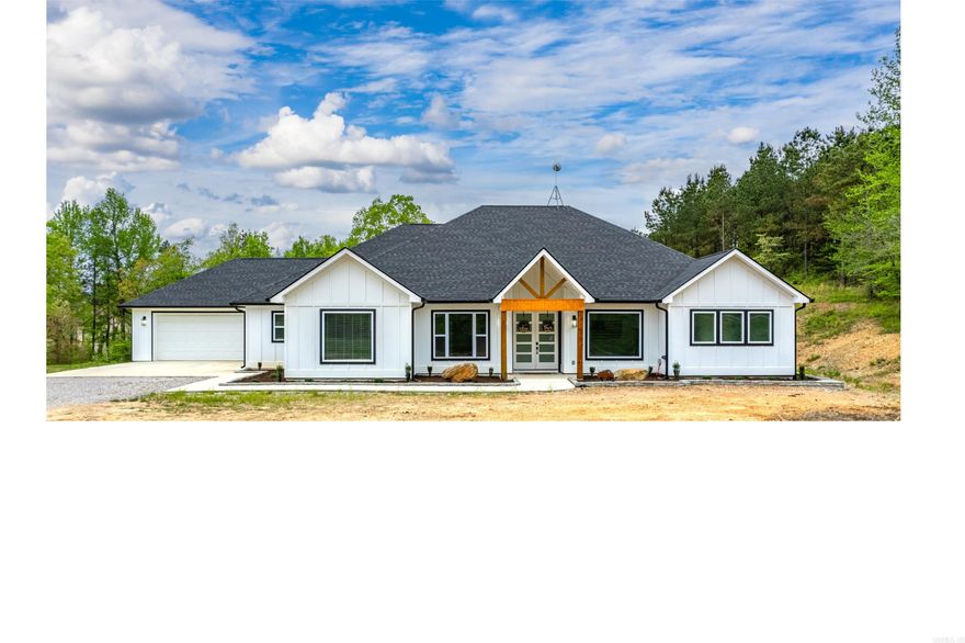 Welcome to your dream modern farmhouse oasis nestled on 4.53 acres of serene countryside. This luxurious 4-bed, 4 1/2-bath home offers an expansive 3587 sf of living space. As you step inside, you'll be greeted by a seamless blend of modern design and farmhouse charm. The spacious living area features a cozy fireplace. Entertain guests in style in the gourmet kitchen, adorned with quartz countertops, a walk-in pantry, and luxury vinyl plank floors throughout. Retreat to the primary bedroom oasis with its very own fireplace, massive shower w/double shower heads and large soaker tub. Large windows throughout the home flood the space with natural light. Two of the three guest bedrooms offer ensuite bathrooms. Separate office provides a space for productivity, fiber optic internet is available. Storage will never be an issue with ample closet space and tons of storage options throughout the home. Plus, the custom-built insulated wellhouse with water softener ensures your water needs are met efficiently. Expansive outdoor covered patio, complete with a fireplace. The gated entrance provides added security & privacy. Embrace the tranquility of country living with the modern comfort.