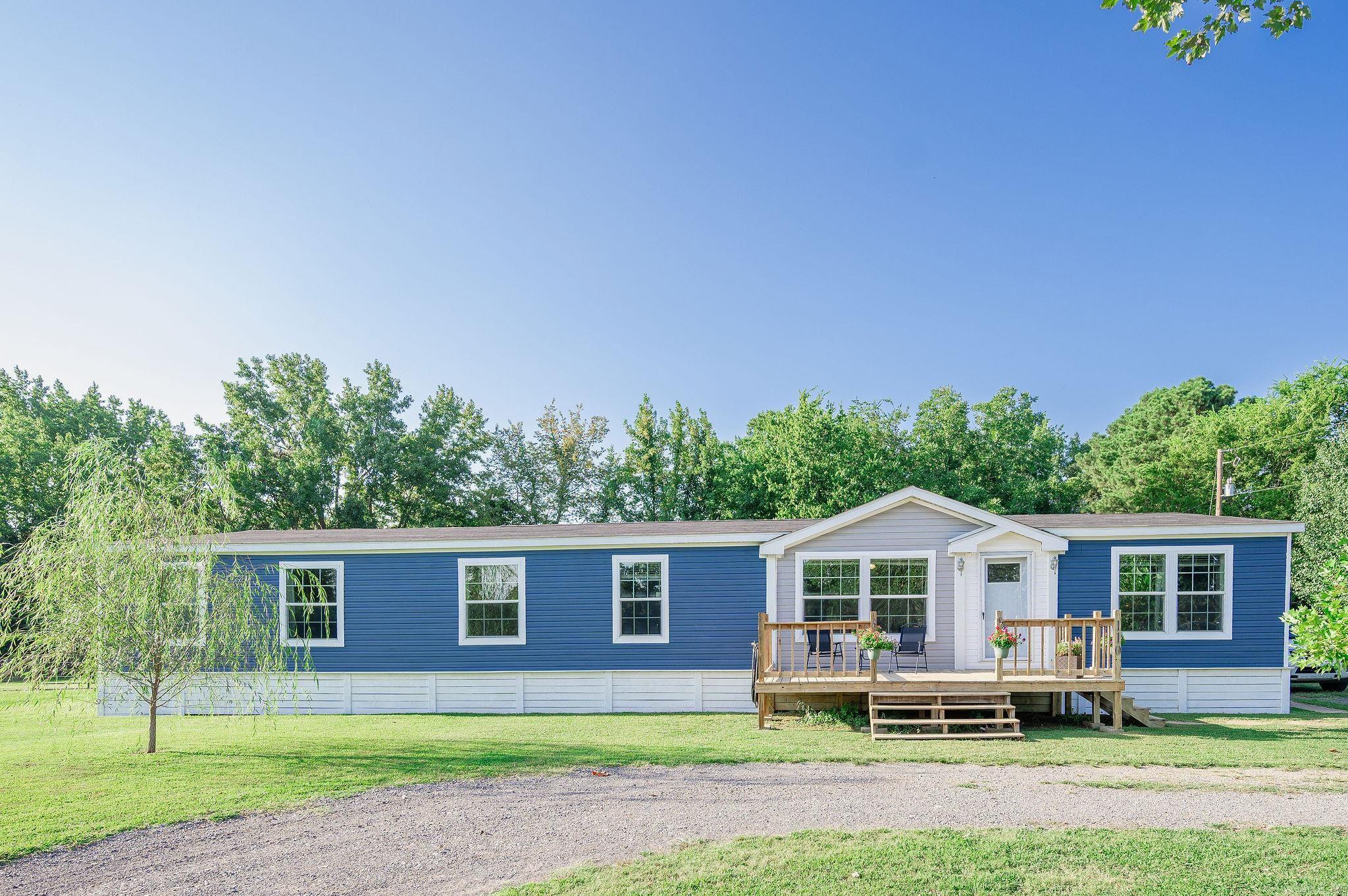 This custom farmhouse offers modern elegance with thoughtful craftsmanship.The home boasts four spacious bedrooms and two beautifully appointed bathrooms. The master suite is a homeownerās dreamāfeaturing an oversized walk-in shower, soaker tub, double vanities, and a large closet. The layout is inviting, with double living rooms that provide both comfort and versatility, while farmhouse styling adds character and timeless appeal. The additional bathroom in the home features an oversized tub as well to provide accessibility to any and all family members or guests. Outside, you'll enjoy the security of a fully fenced backyard, complemented by brand new wood underpinning that speaks to the quality of construction and durability. Two additional concrete slabs and utility hookups provide the perfect place to build a shop as well. The property is handicapped/wheelchair accessible. This is more than a houseāitās a thoughtfully crafted retreat ready to welcome you home. *PERMANENT FOUNDATION*