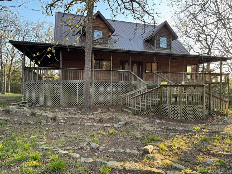 Discover your serene retreat in this stunning craftsman-style lake home! Nestled on 5 wooded acres m/l bordering Corp land, this 5-bedroom, 4.5-bath sanctuary offers privacy and tranquility. Enjoy the expansive wrap-around deck, perfect for outdoor gatherings. The finished full basement provides additional living space, while the large, detached garage accommodates all your needs. Relax by the koi pond or unwind in the charming gazebo. Your dream home awaits!