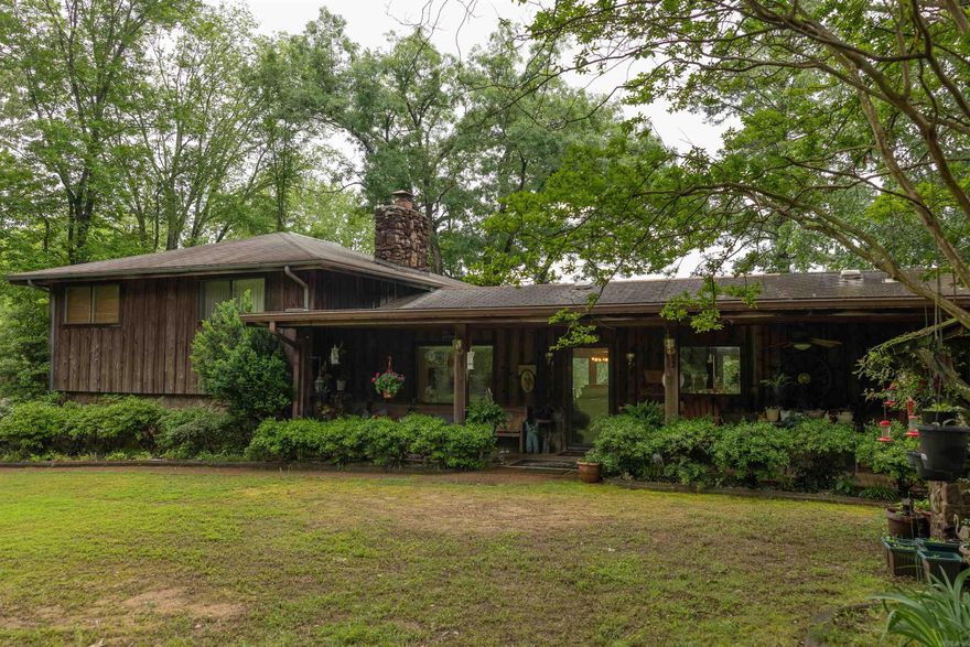 CUSTOM BUILT HOME BOASTS CHARM, CHARACTER & NOSTALGIA!!! Located on what was formerly known as Lindsey’s Resort. The large windows offer beautiful views of The Little Red River. The open floor plan provides room for entertainment. The home offers 4 bedrooms and 3 full baths. Other features include natural hardwood floors and 2 beautiful natural stone fireplaces. Outside you will find a charming outdoor kitchen fully equipped for all of your outdoor entertaining. The shop with 2100 sq ft offers plenty of room to house whatever hobby you have and includes an 800 sq ft apartment for additional living space. This is a must see!!!