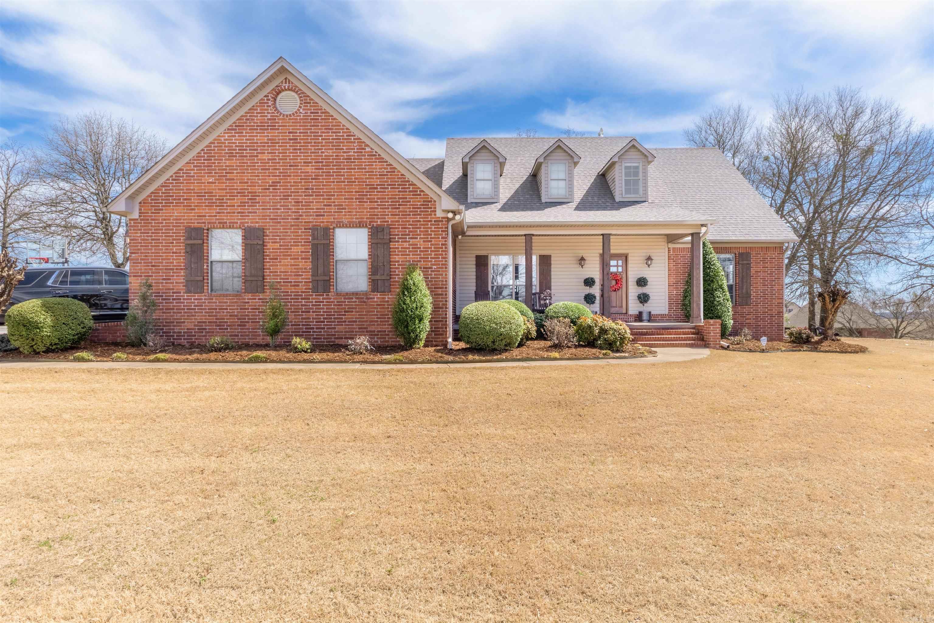 Nestled in the desirable Woodridge Subdivision, this beautiful custom-built home sits on 2 acres within the sought-after Greenbrier School District. Boasting a spacious and functional layout, the home features a split floor plan with 4 bedrooms, 3 full bathrooms, and a large upstairs bonus room that can easily serve as a fifth bedroom. Step into the kitchen and you’ll find custom cabinetry with abundant storage and unique character, two pantries, and a newly updated, generously sized breakfast room. The living room offers plenty of space for entertaining, and flows seamlessly into the formal dining area. Outdoor living is a highlight of this property! Enjoy the beautifully landscaped yard from the custom covered back porch, complete with a wood-burning fireplace and tongue-and-groove vaulted ceilings. Or host gatherings around the established fire pit and outdoor kitchen area – perfect for entertaining year-round. Additional features include: 2 brand-new HVAC units, 3-year-old hot water heater, Updated flooring throughout and Impeccably maintained condition. This home truly has it all – space, comfort, style and outdoor charm. Schedule your private showing today!