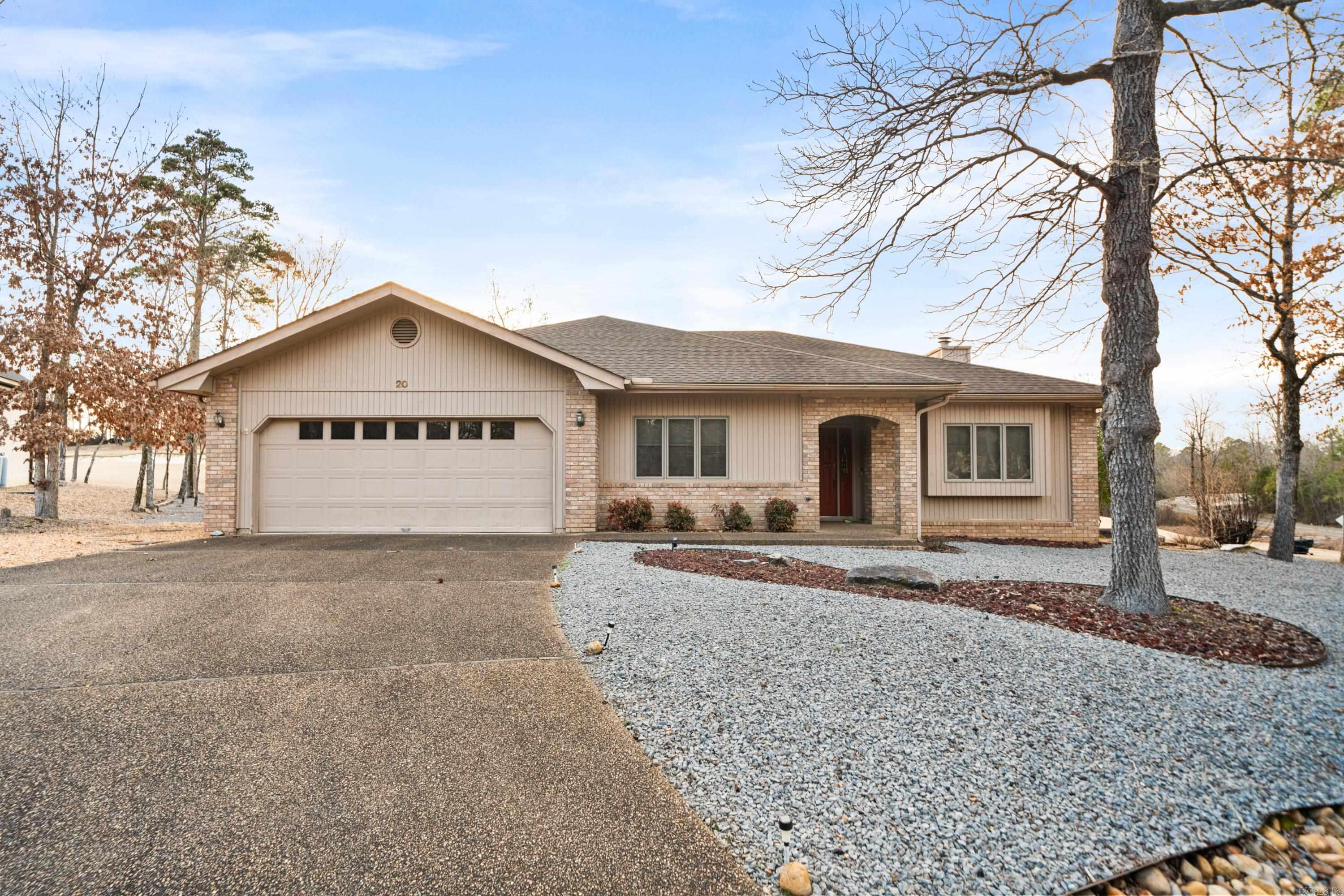 This charming one level home features sweeping views of the #2 green and fairway of Magellan Golf Course. You'll love relaxing on the back patio, watching the golfers go by, or simply savoring the peaceful ambiance of this sought-after location. Inside, pride of ownership and care is apparent in this one-owner home. The bright, open floor plan is ideal for entertaining and everyday living. The spacious kitchen features updated countertops and backsplash, and the main living areas include updated flooring. The generously-sized master suite is a true retreat, complete with a double vanity in the bathroom and a large walk-in closet. Outside, the low-maintenance landscaping allows you to spend more time enjoying the beautiful surroundings. Don't miss this opportunity to have an affordable home with a spectacular view in the heart of Hot Springs Village.