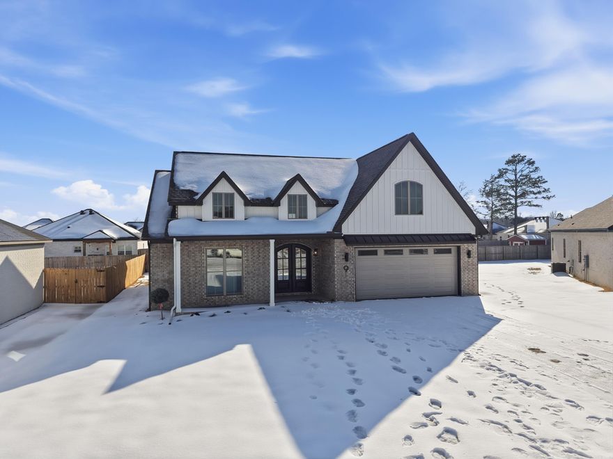 Welcome home to this transitional beauty—where timeless charm meets modern luxury, built by Jim Atkinson. Thoughtfully designed with cozy character and sleek, open-concept living, this nearly completed new construction offers both style and function in every detail. Home Highlights:    •   Split floor plan for privacy    •   10’ ceilings in the great room & a stunning 12’ ceiling entry    •   Electric fireplace for warm, inviting living    •   Wainscoting in kitchen & dining for classic elegance    •   Custom cabinets with soft-close doors & drawers    •   Large walk-in pantry     •   36” electric range & microwave drawer    •   Electric water heater    •   Spacious laundry room with abundant cabinets, folding counter, and dedicated space for ironing board or laundry baskets    •   Large attic area decked for extra storage Primary Suite Retreat:    •   Custom walk-in shower with bench    •   Freestanding soaking tub    •   Separate makeup vanity with knee space    •   Two linen stacks    •   Above-toilet cabinetry in both bathrooms This home blends classic detail with modern convenience, creating a warm, welcoming space that’s built to last.