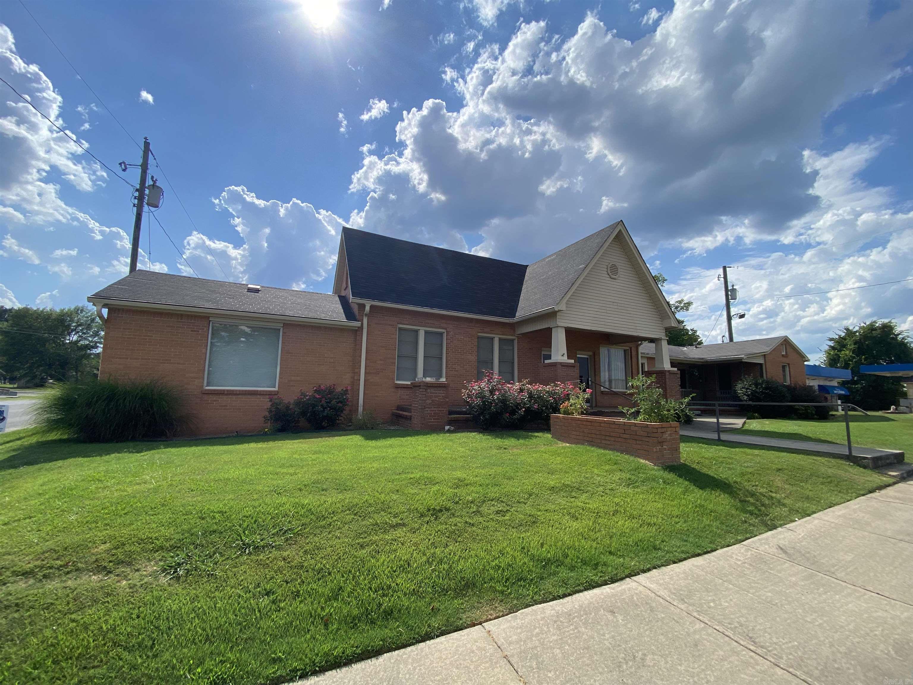 3,900 sqft feet that has adjoining 3 bedroom and 2 bath apartment with its own entrance and private back yard. Sitting on highway frontage just minutes from Mount Nebo State Park, Mount Magazine State Park and Petite Jean State Park! Come take a look at what this property can offer you.