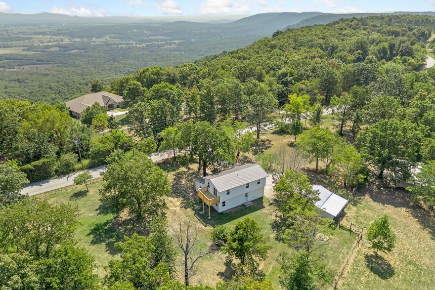 Modern Farmhouse…… with options.  This 4 bedroom, 2 bathroom has been fully remodeled and is ready for its next owner.  It sits on two acres, one of which is accessible from the road behind it and could easily be sold off or be used for livestock.  All four bedrooms are spacious and the kitchen is completely new.  With low maintenance exterior and a brand new double unit HVAC system in 2025, the heavy lifting is taken care of.  22 minutes to Ponca and the Buffalo National River, 44 minutes to Branson, MO, 90 minutes to NWA and just a few minutes from schools, shopping and healthcare.  This one is worth a look.