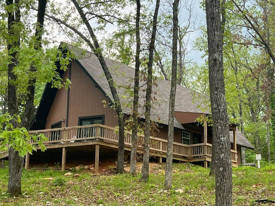 This 'RUSTSIC MOUNTAIN LAKE CABIN' OVERLOOKS LAKE SHERWOOD, a spring fed 110 acre private recreation lake in north central Arkansas Ozark Mountains.  The 3 bedroom, 2 bath A-frame rustic cabin sits on almost 1/2 acre with large hardwood shade trees. On the main walk-in level are 2 guests rooms, 1 full bath, kitchen, laundry room & a vaulted living/dining room w/ pool table & games for you & your guests. Each guest bedroom has it's on private entrance. The living room/ dining room have vista views of the gated, private dock & boat launching ramp with & private picnic park. The master loft en-suite has a small sitting area & master bath. There is a wrap around deck great for entertaining & relaxing. Another feature is the firepit & outdoor lounge w/grilling area.  The cabin has city water & city sewer. This property is an ideal family vacation get a way lake cabin &/or generate income as an Airbnb. It is located about 1/4 mile from Spring River for canoeing, kayaking, fishing & rafting.  Lake Sherwood offers skiing, fishing, kayaking, swimming & other lake activities. Or take your side/by downtown to Hardy's eating places & shopping. This could be your Ozark Mountain Lake cabin!!