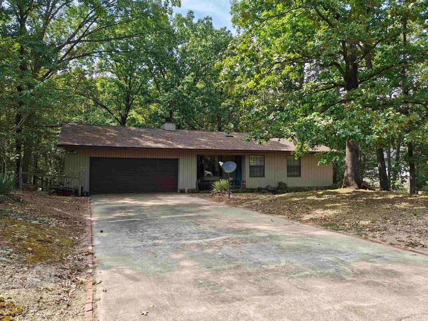 This lovely home is located in the serene Diamondhead Subdivision. Property has mature trees, which adds to the privacy, beauty, and you will love watching nature, from your lovely, private deck.  You will love the amenities at our 18 hole PGa golf course, the Olympic size swimming pool, basketball & pickleball courts, club house and Lake Catherine access.  The roof is less than a year old.