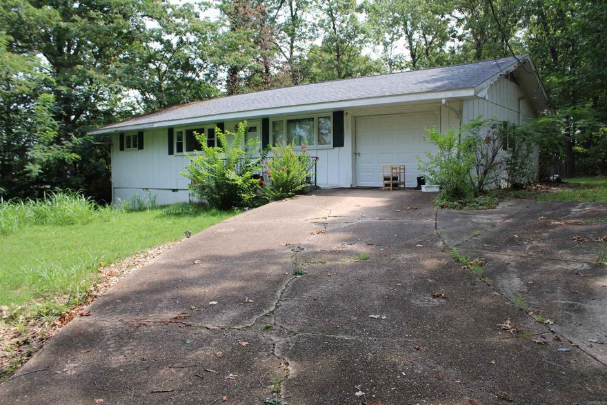 UNDER $100,000! This home is sitting at the end of a dead-end street. Three full bedrooms with a bonus room. 1 ½ bath, Spacious living room and kitchen. Half of the Garage was converted into living space but could easily be turned back into the full garage if you wished. Conveniently located minutes from Lake Norfork Access, White River Access and North Fork River! Also, located approx. 10 minutes from shopping, medical, employment and schools. This is a deal that you won’t want to pass by!
