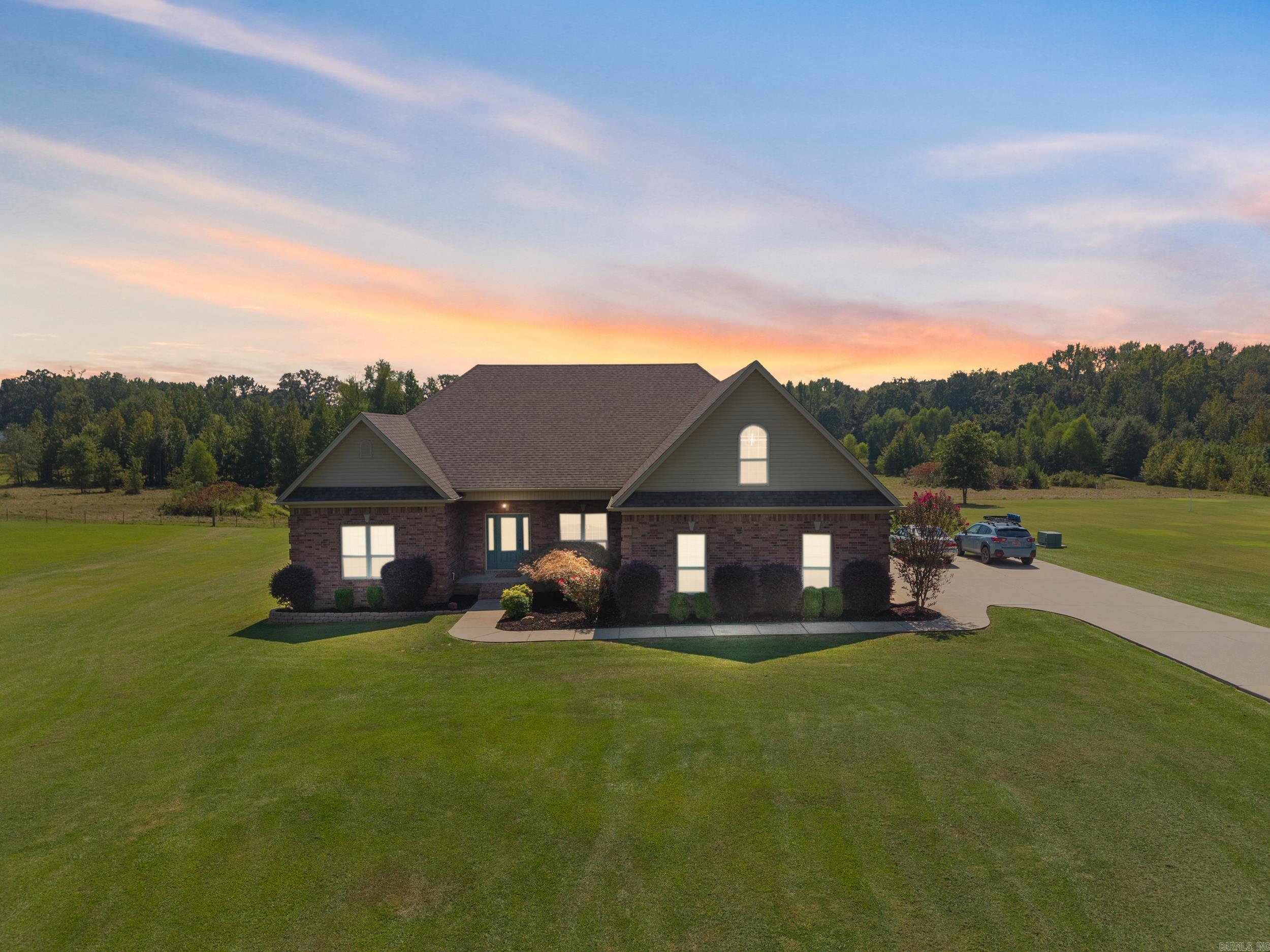 This beautifully maintained home on one acre, with an in-ground pool, offers 4 spacious bedrooms, 2 full bathrooms, and a versatile bonus room that can easily serve as a 5th bedroom or home office. The open floor plan features a formal dining room and a cozy den with a gas fireplace, all under soaring 10ā12 ft ceilings that enhance the home's open, airy feel. The kitchen is a chefās dream with stainless steel appliances, quartz countertops, a breakfast bar, and rich wood cabinetry. Upstairs, youāll find a large bonus room complete with built-in office space, perfect for remote work or hobbies. A walk-in attic offers the potential for additional square footage in the future. The primary suite features walk-in closets with built-in dressers, a jetted tub, a walk-in shower, and newly updated granite countertops. Additional bedrooms also include walk-in closets, offering abundant storage throughout the home. Outside, enjoy your private backyard oasis with a covered porch and a 20x40 in-ground poolāideal for entertaining or relaxing. The oversized 3-car garage provides ample space for large trucks or SUVs. Recent updates include: New HVAC, Fresh interior paint, pool liner, and roof!