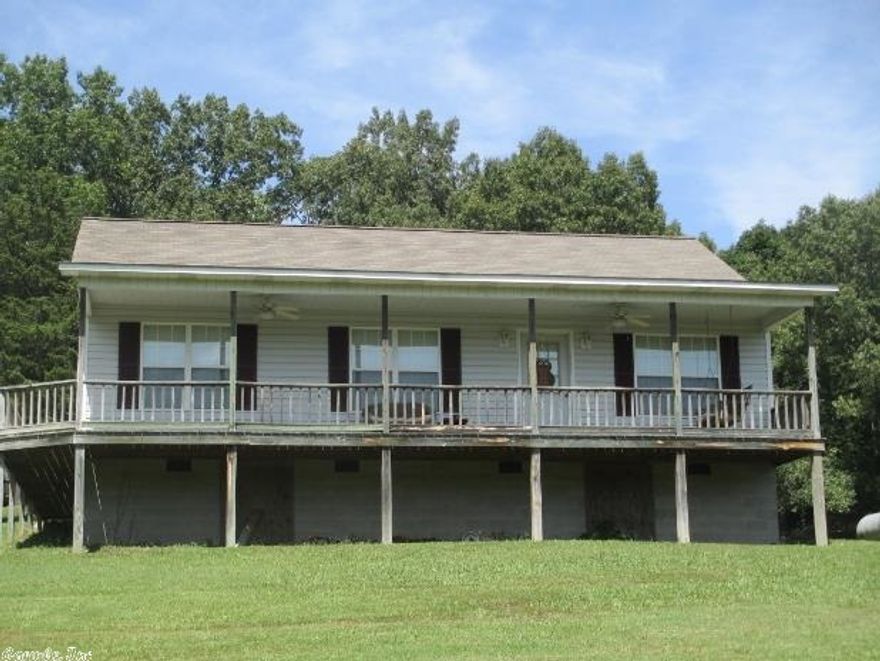 No.01360 Nice home, with country setting close to town 3 bedroom 2 bath 1240 sq ft. with wrap around porch on 2 sides. Vinyl siding on 1.5 acres $139,900