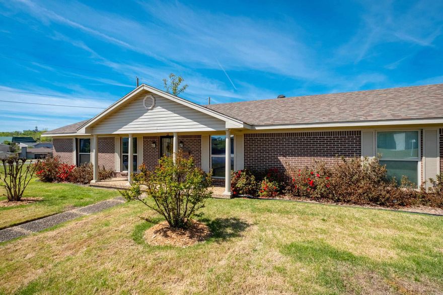 Renovated & Move-In Ready! One level 3 BR/2B home on level fenced lot w/ 2-car side-load garage w/ storage or workshop space. Owners inherited property and giving estimated dates on items. After the storm these items new in 2023: Roof, windows, siding, Flooring, Fence, Deck cover, 2 sets French doors, Fresh interior paint, Ceiling fans, Fireplace logs w/ remote control & Window Coverings. Washer & Dryer stay & 1-2 years old. Refrigerator stays. Whole house generator 3-4 yrs old. Water heater 2022, Furnace 5 years or so &  A/C compressor older than 5 years. Mounted TV over fireplace stays. Walk-in pantry in kitchen. Very clean & shows so nicely. Surrounded by several nice new construction home. Location convenient to multiple restaurants & shopping options!  The home owner dues are mandatory annually paid earlier this year 103.97 The pool is extra and it is opening in May The pool is 175 if paid early bird by May 1 and 225 if paid later They are also opening up a pickle ball court beside the tennis court in the park