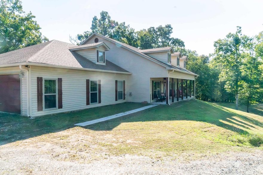 Custom Built Home on Just Under 10 Acres  2,524 sq. ft., Pressure Washed & Ready, with updates.  4 Bedrooms (or 3 + office), 2.5 baths Open Floor Plan with large living room & indoor fireplace Beautiful stained concrete floors throughout Kitchen: granite counters, double ovens, built-in microwave, trash compactor, large pantry, eat-in breakfast area + formal dining Master suite: deck access, 2 walk-in closets with auto lighting, walk-in shower, jetted tub, dual sinks Outdoor living: full-length back deck with fireplace, country-style front porch freshly painted/updated Systems: new HVAC (2025 Heat Pump) electric water heater, roof ~6 years old 30x30 metal shop with 14’ walls, 10’ electric door, water & electricity + lean-to for additional storage Private setting ~½ mile off Hwy 298 on gravel road, surrounded by wildlife  Serene country living at its best with frequent deer & wildlife sightings! Property includes 2 Parcels adjacent. Septic Tank just (Sept) replaced/updated Agents-See agent remarks
