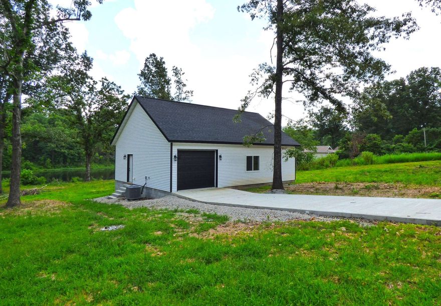 Custom Built Home on Beautiful Lake Omaha - This home offers 1290 sq ft with 722 sq ft of living space. Living room, kitchen, bedroom, bath and large garage. It sits on a flat lot with easy access to Lake Omaha. With 3 lakefront lots there is plenty of room to add on to the exiting home, or build another house and use the existing space as a guest house or a great vacation rental. The possibilities are endless. Lake Omaha is a 140 acre recreational lake perfect for tubing, fishing, kayaking, or just swimming on hot summer days.