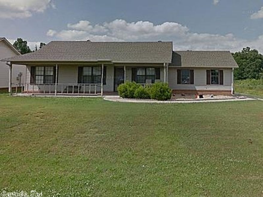 Take a look at this house and you will call it home. 3 bedroom 2 baths New wood laminate in bedrooms, living room & hallway and tile in kitchen & bathrooms. New, custom cabinetry installed throughout the house with a kitchen island & beautiful glass tile backsplash in the kitchen as well. Large kitchen & large master bedroom with walk-in closet.   Large privacy fenced in back yard with a 10x 12 storage building and also a 24 ft above ground swimming pool. Great view of Reynold's lake from you front porch.